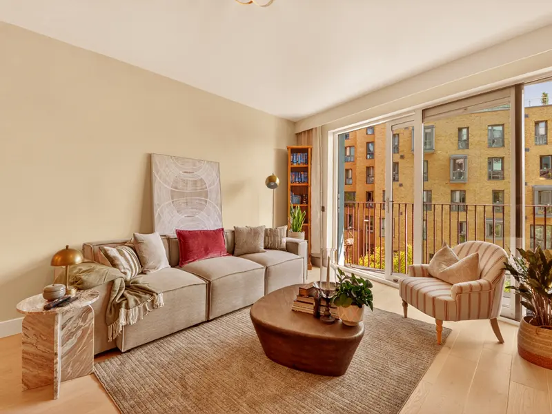 Bright renovated living room with balcony views