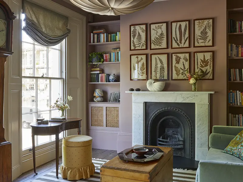 Renovated period sitting room with chevron floor and original fireplace