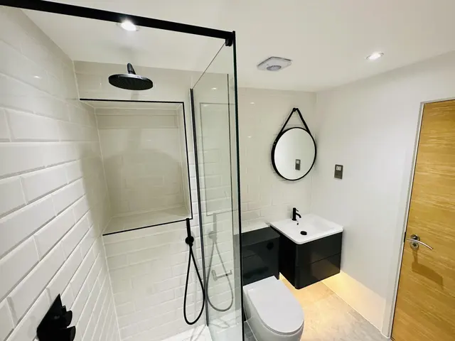 New bathroom with walk-in rainfall shower and white brick tiles