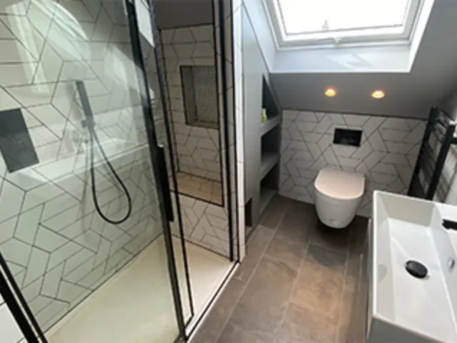 Loft conversion ensuite with rooflight and walk-in shower